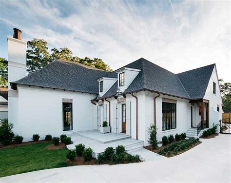 white painted brick house with metal roof|painted brick exterior houses.